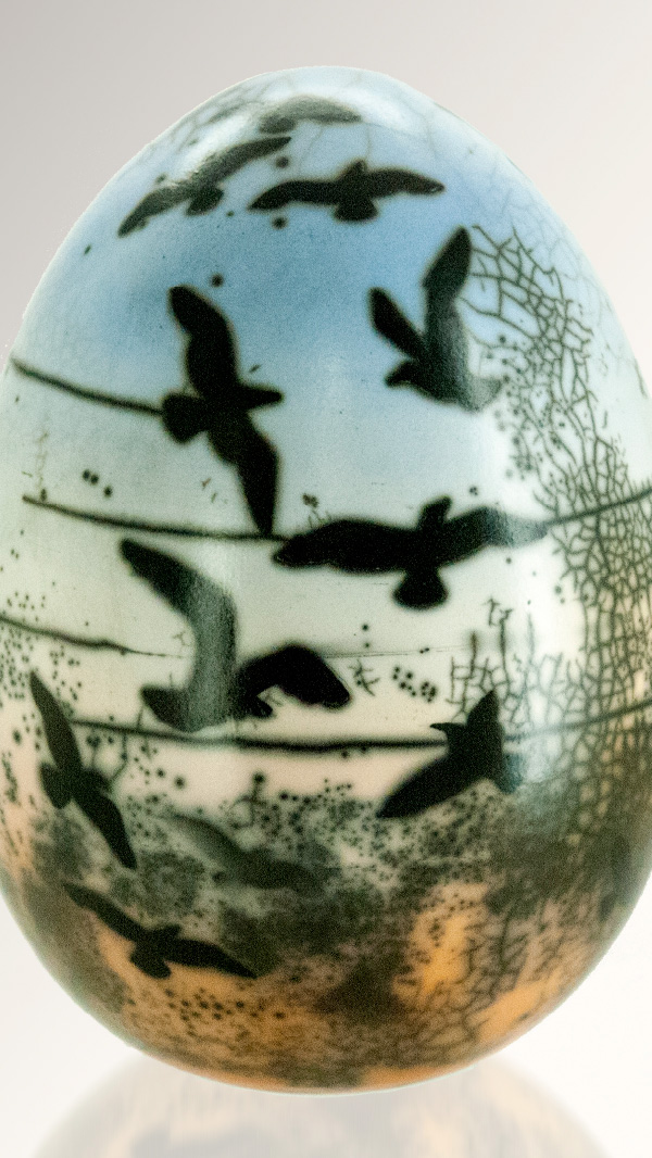 naked raku pot with birds